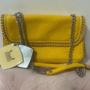 Henri Bendel yellow shoulder bag with mirror
